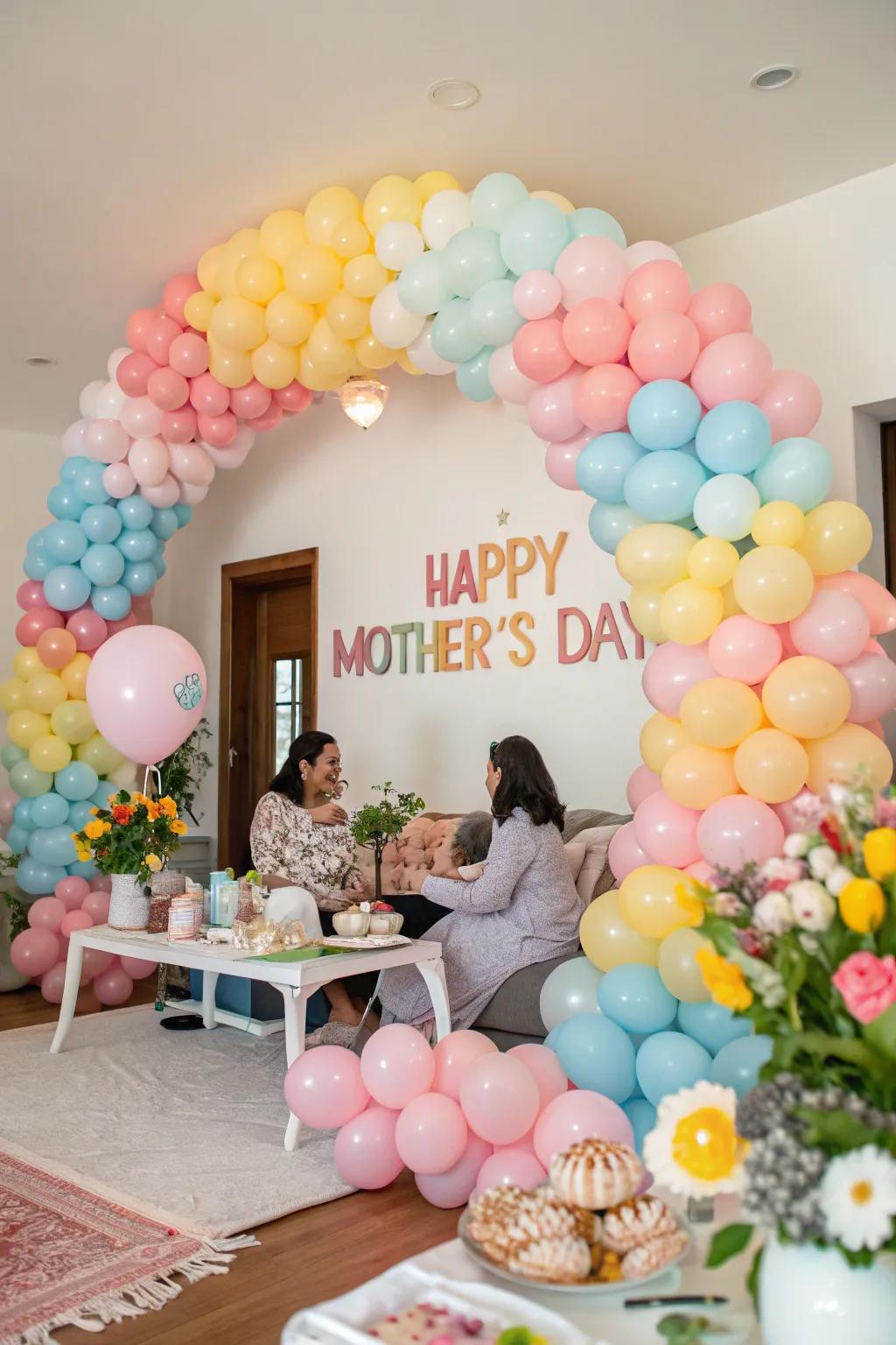 A vibrant pastel balloon arch perfect for a Mother's Day celebration.