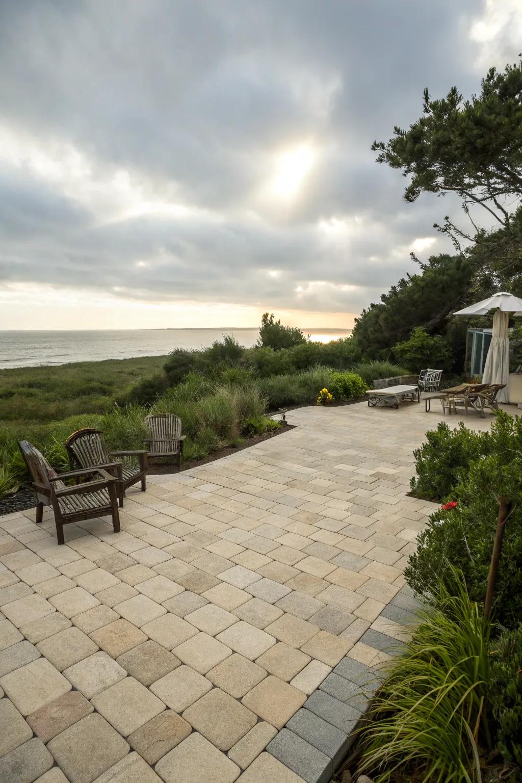 A paver patio with light-toned pavers, exuding a breezy coastal atmosphere.