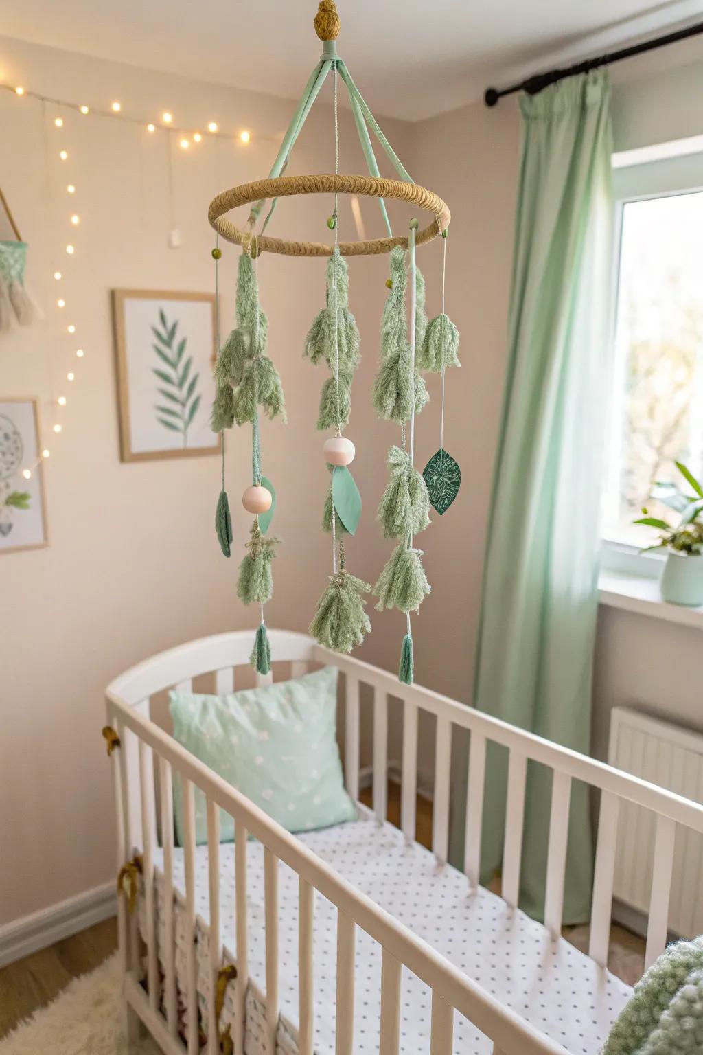 A DIY mobile adds dynamic visual interest to a sage green nursery.