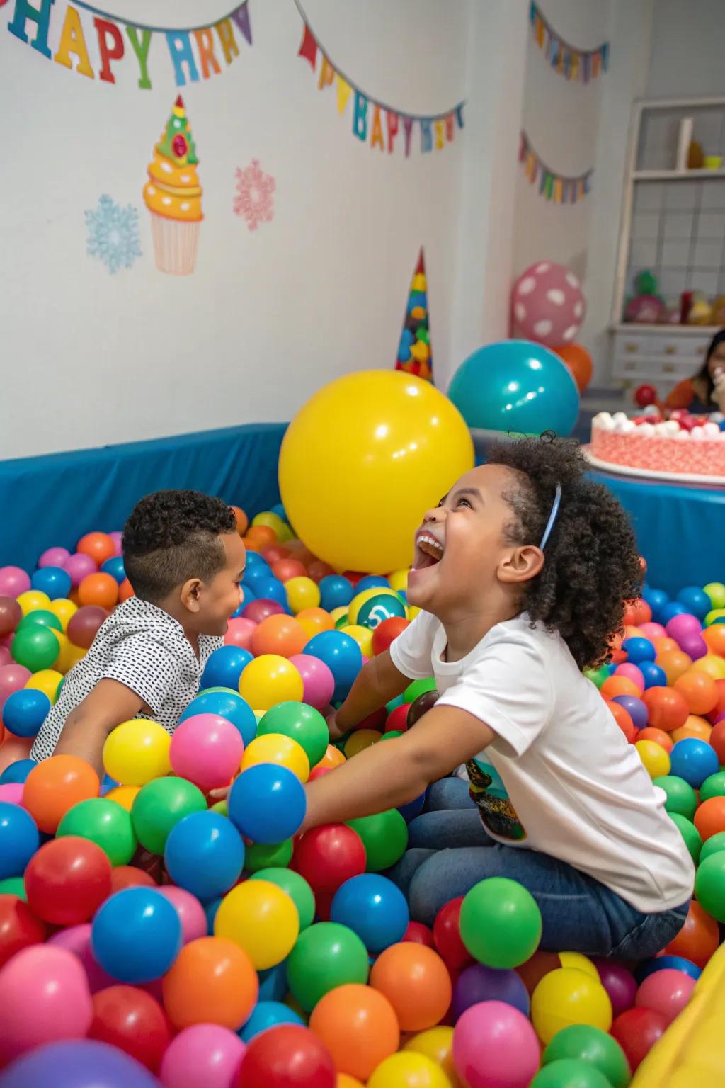 A vibrant ball pit ensures giggles and joy at a first birthday party.