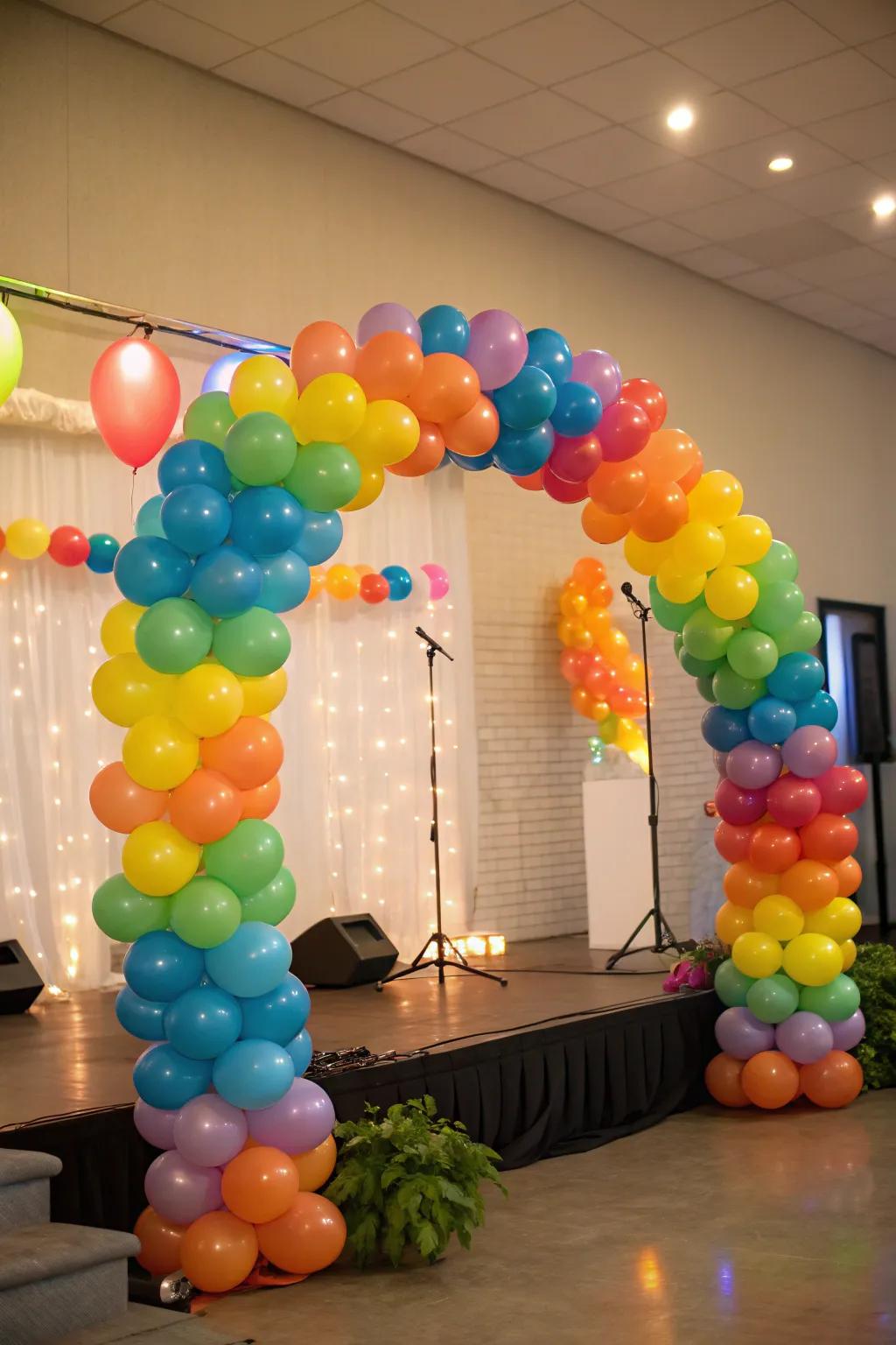 Celebratory balloon wreaths injecting hue and joy into the stage.