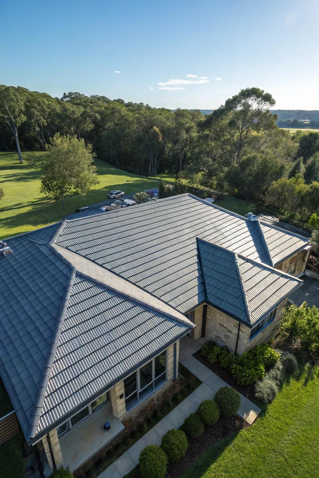 An aerial view of a house featuring energy-efficient cool roof tiles.