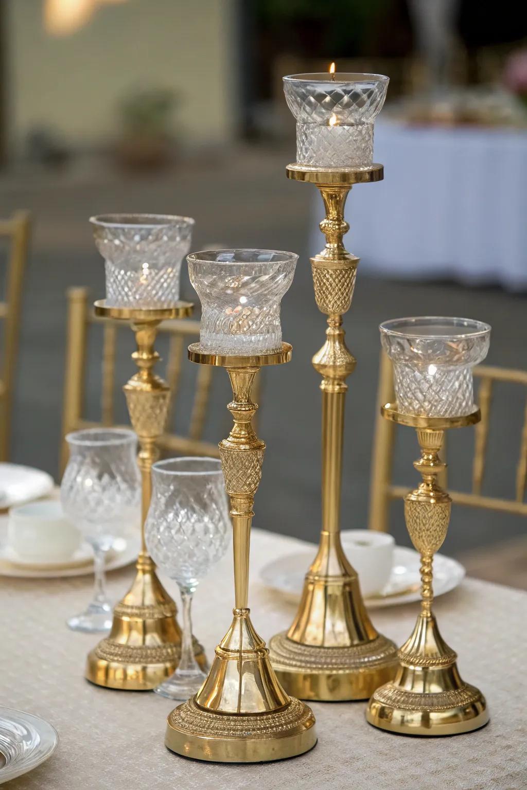 Layered elegance with gold and glass candle holders.