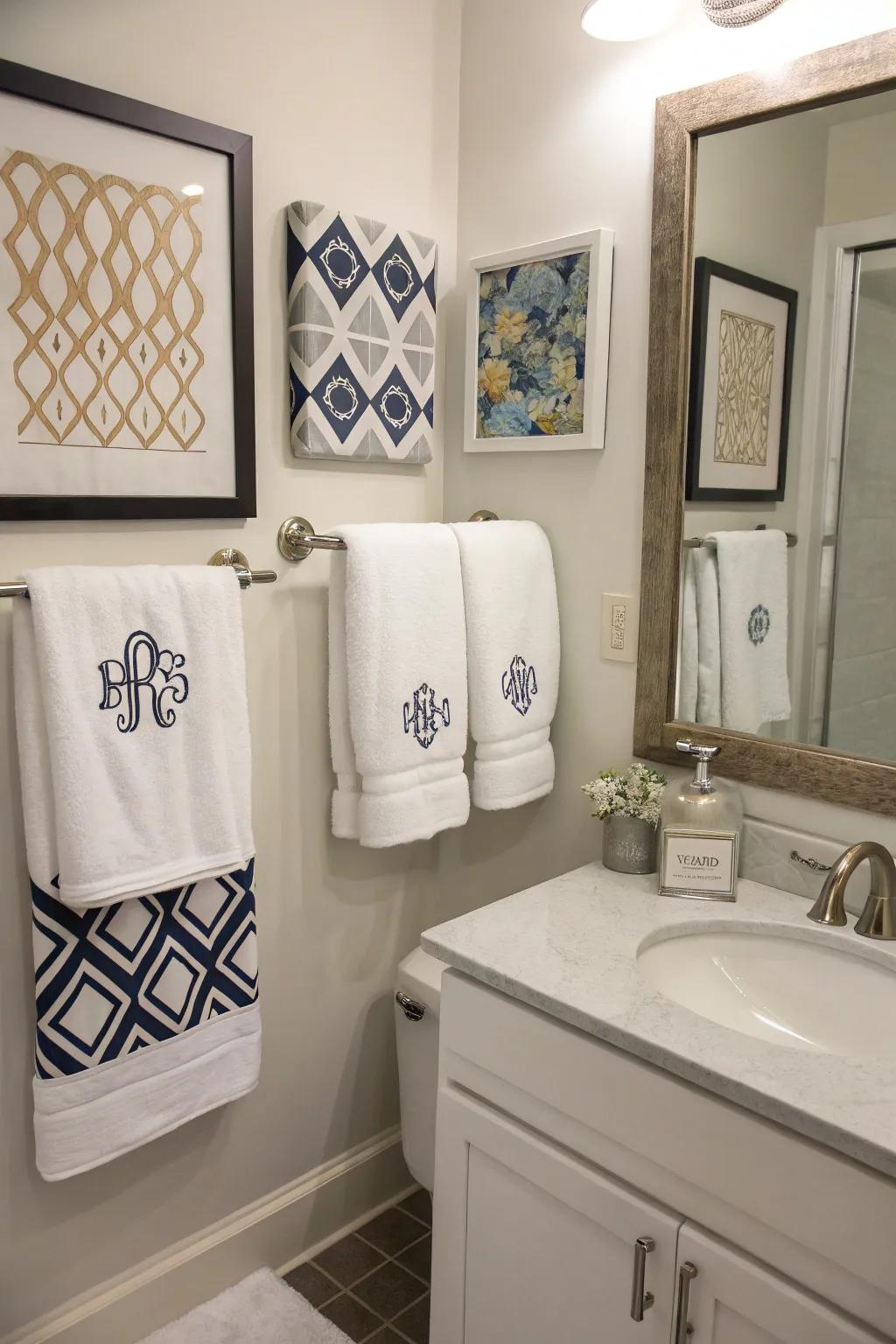 A bathroom with personalized touches including monogrammed towels and custom art.