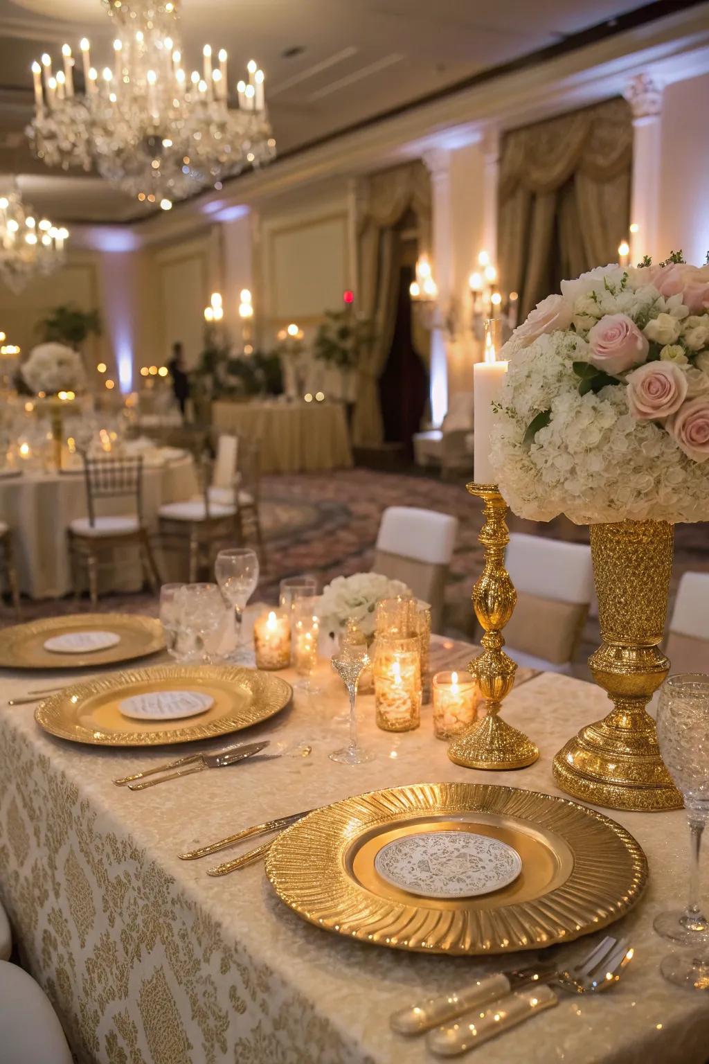 A glamorous sweetheart table with gold accents and sparkling details.