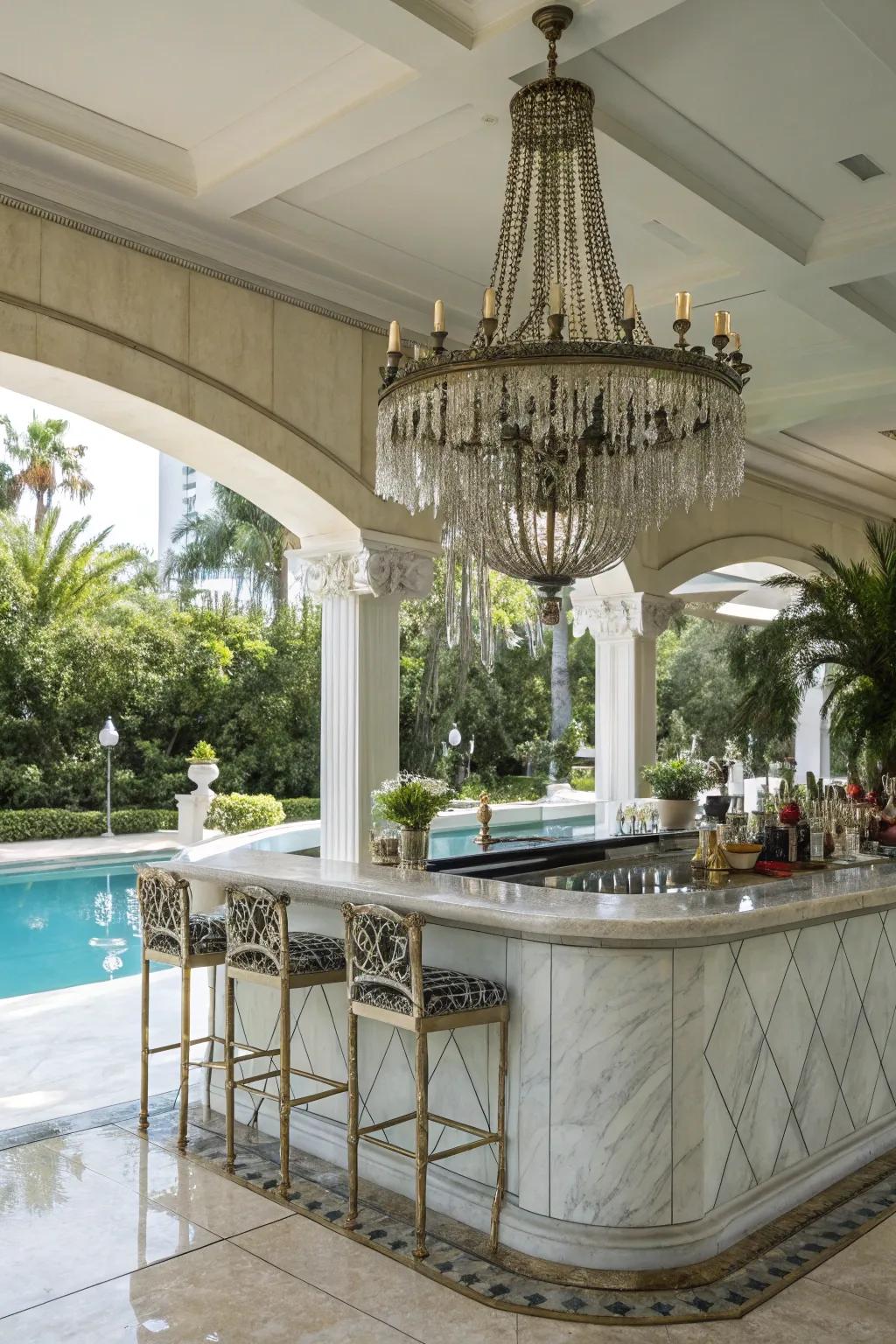 A marble bar with a chandelier adds elegance to your outdoor space.