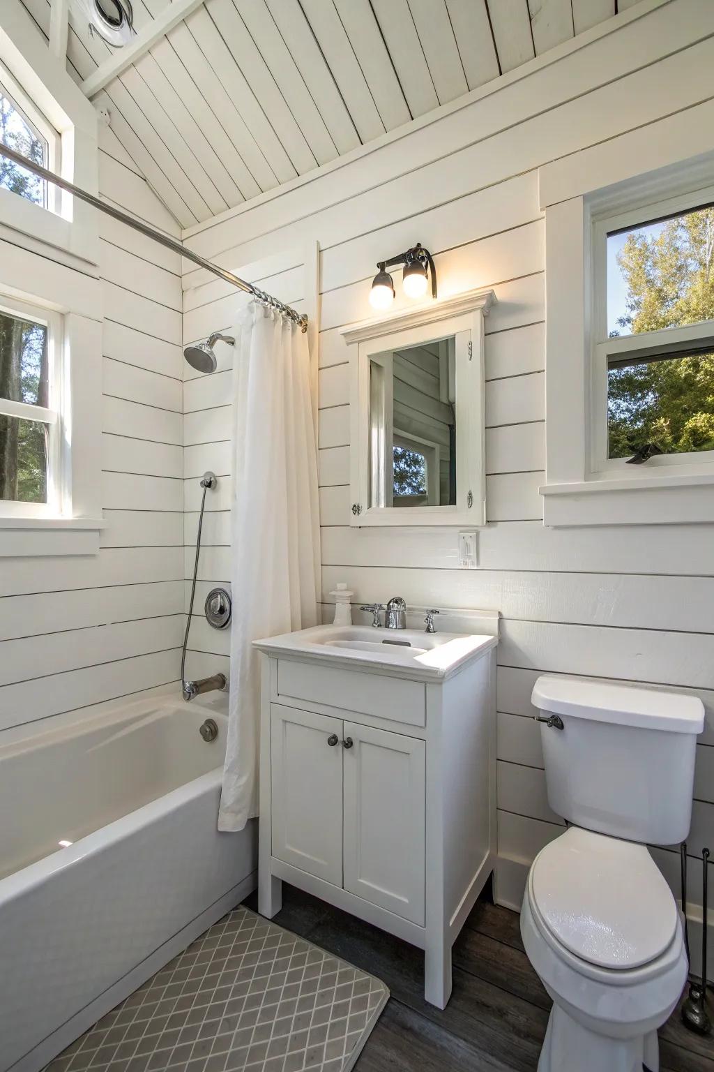 A small bathroom with white shiplap for added charm.