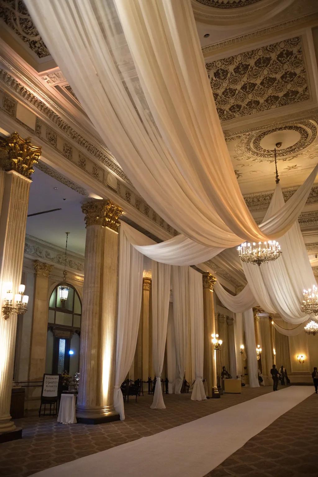 Elegant ceiling draping adds a touch of luxury to the birthday hall.