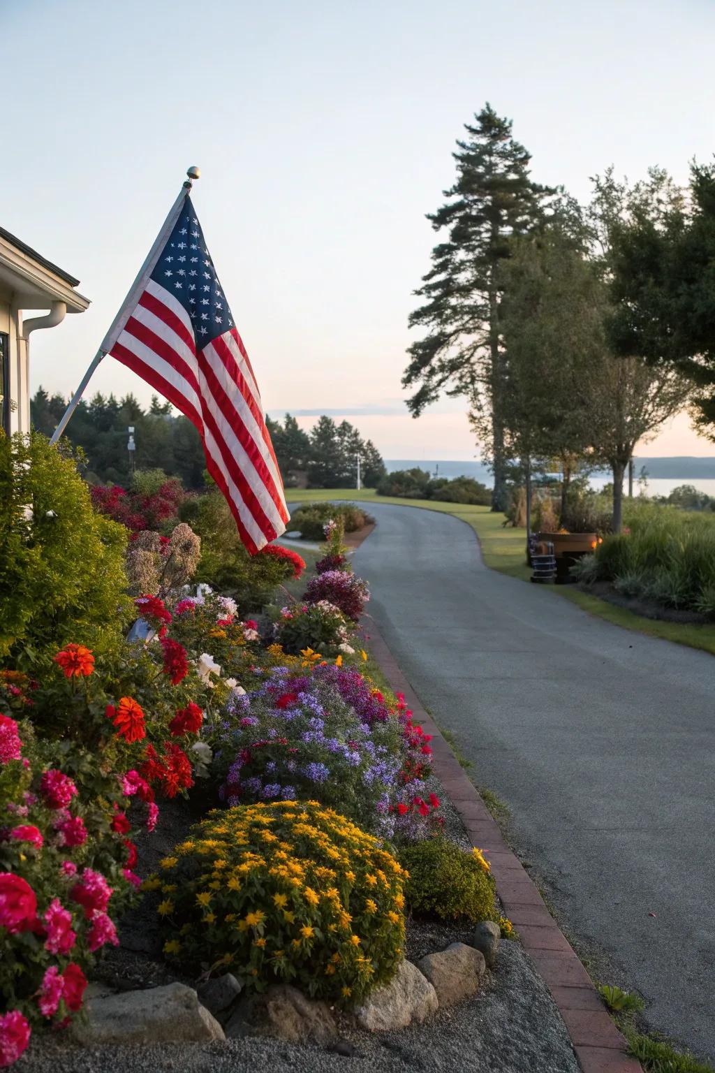 A flag lot driveway lined with vibrant flowers and shrubs, creating a picturesque entry.