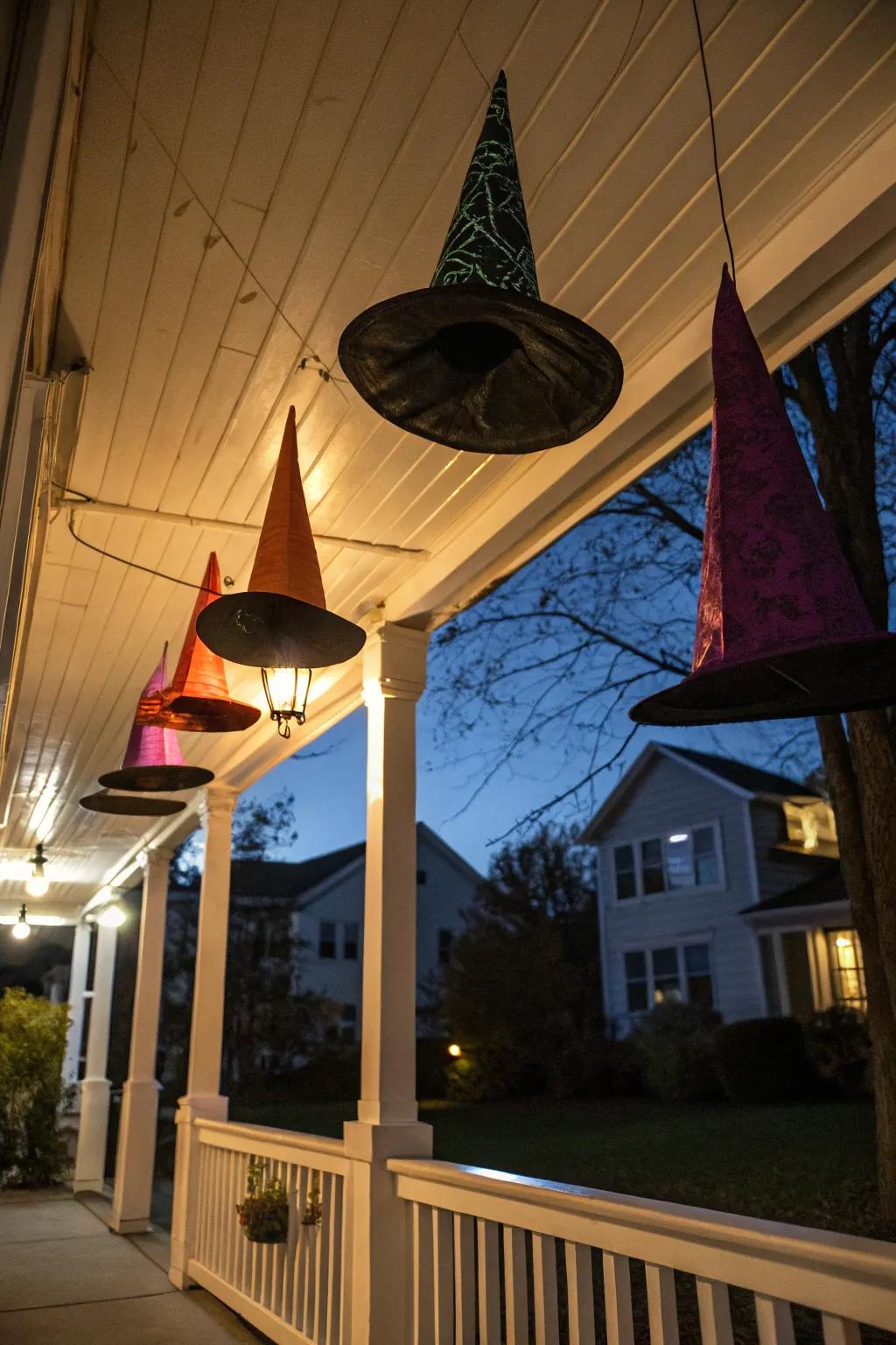 Floating witch hats add a mystical element to this Halloween porch.