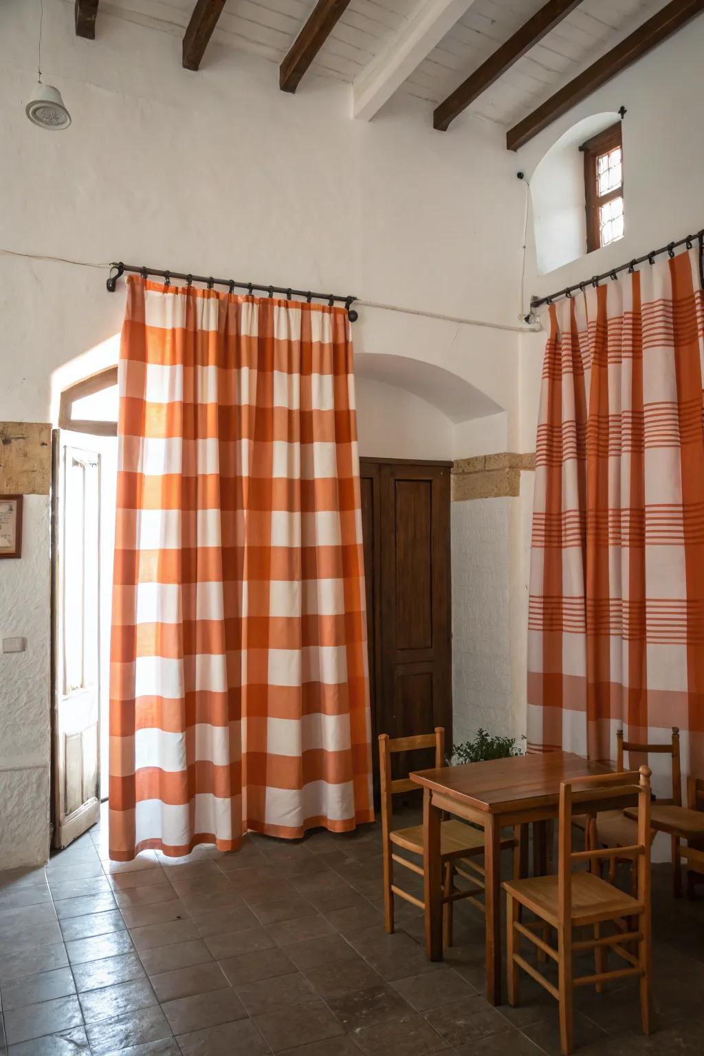 Playful striped orange and white curtains that brighten up a neutral-toned room.