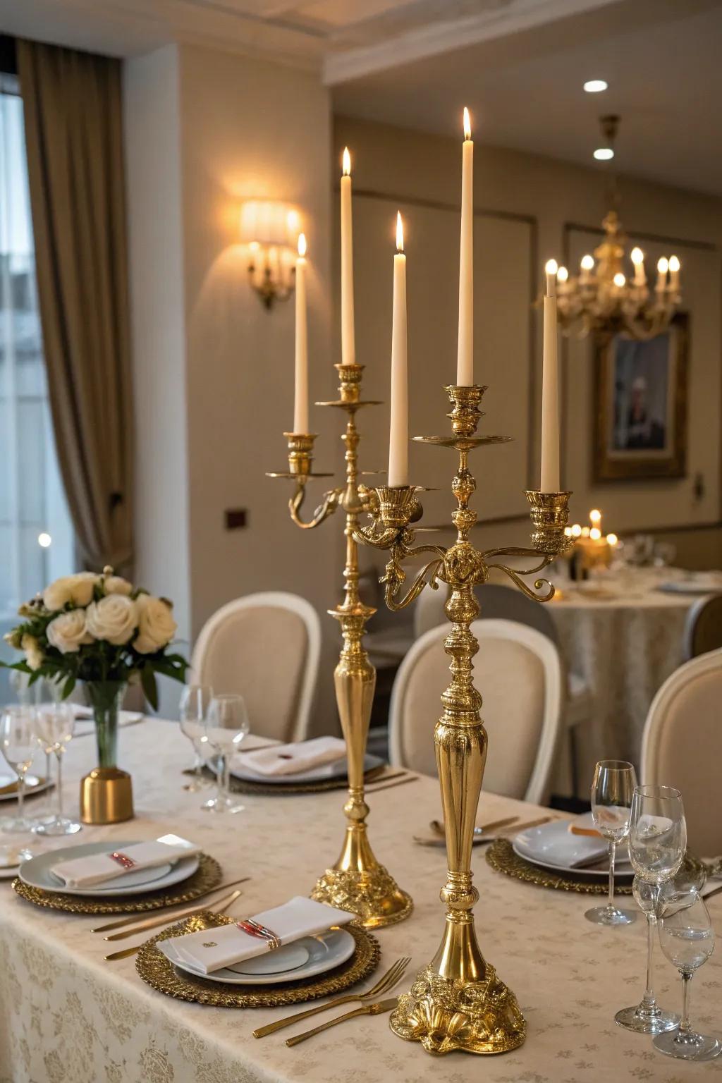 Stunning gilded candle holders establishing a romantic atmosphere.