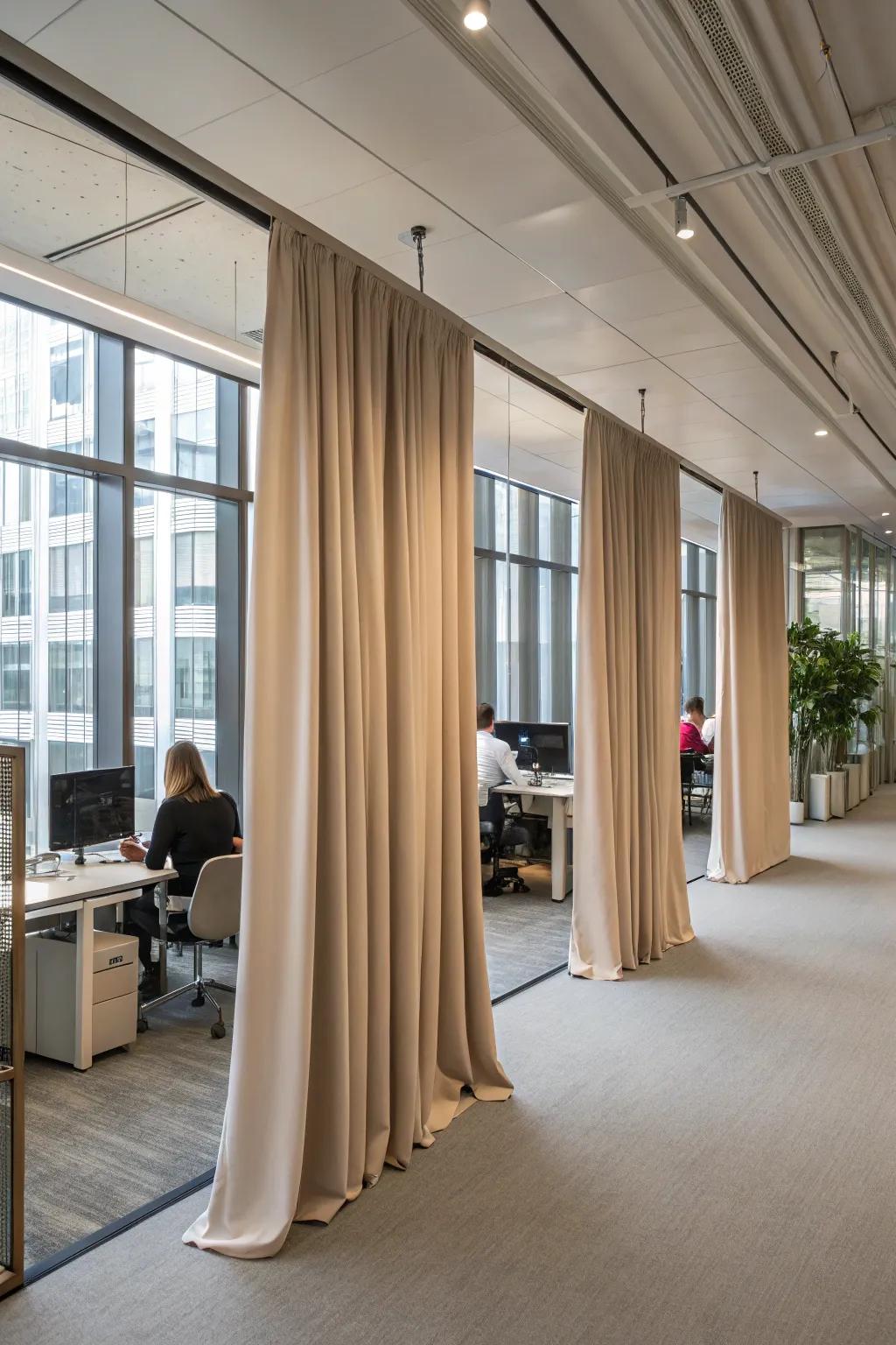 Curtain partitions add softness and flexibility to office layouts.