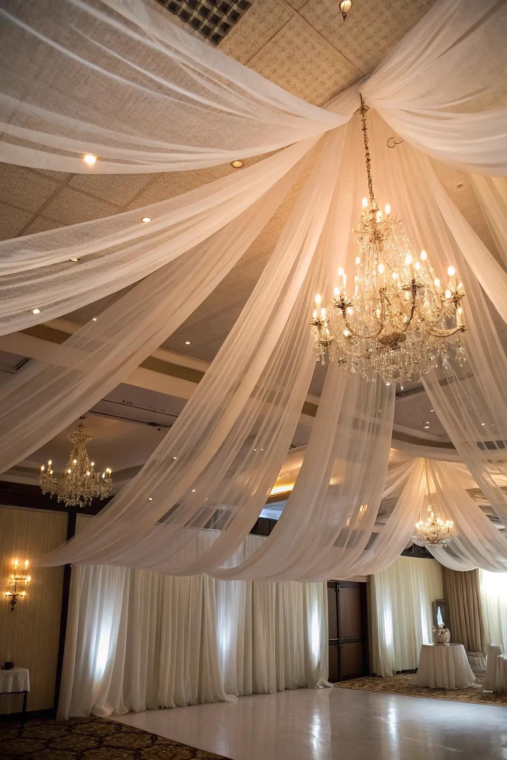 Create a magical atmosphere with tulle ceiling drapes.