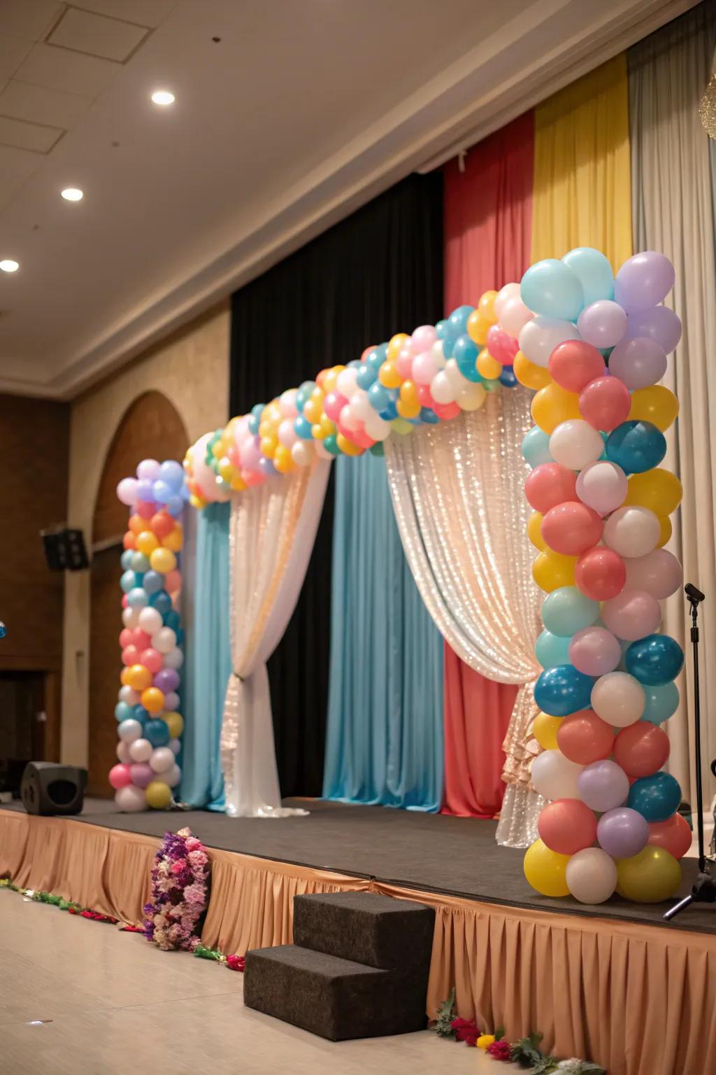 A stage layout exhibiting balloons and elegant shrouds for a cohesive look.