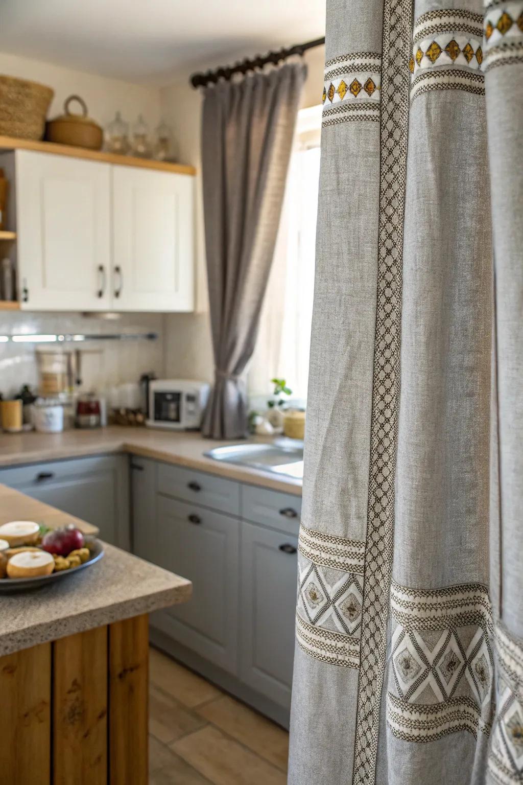 Textured gray curtains add a tactile richness to the kitchen.