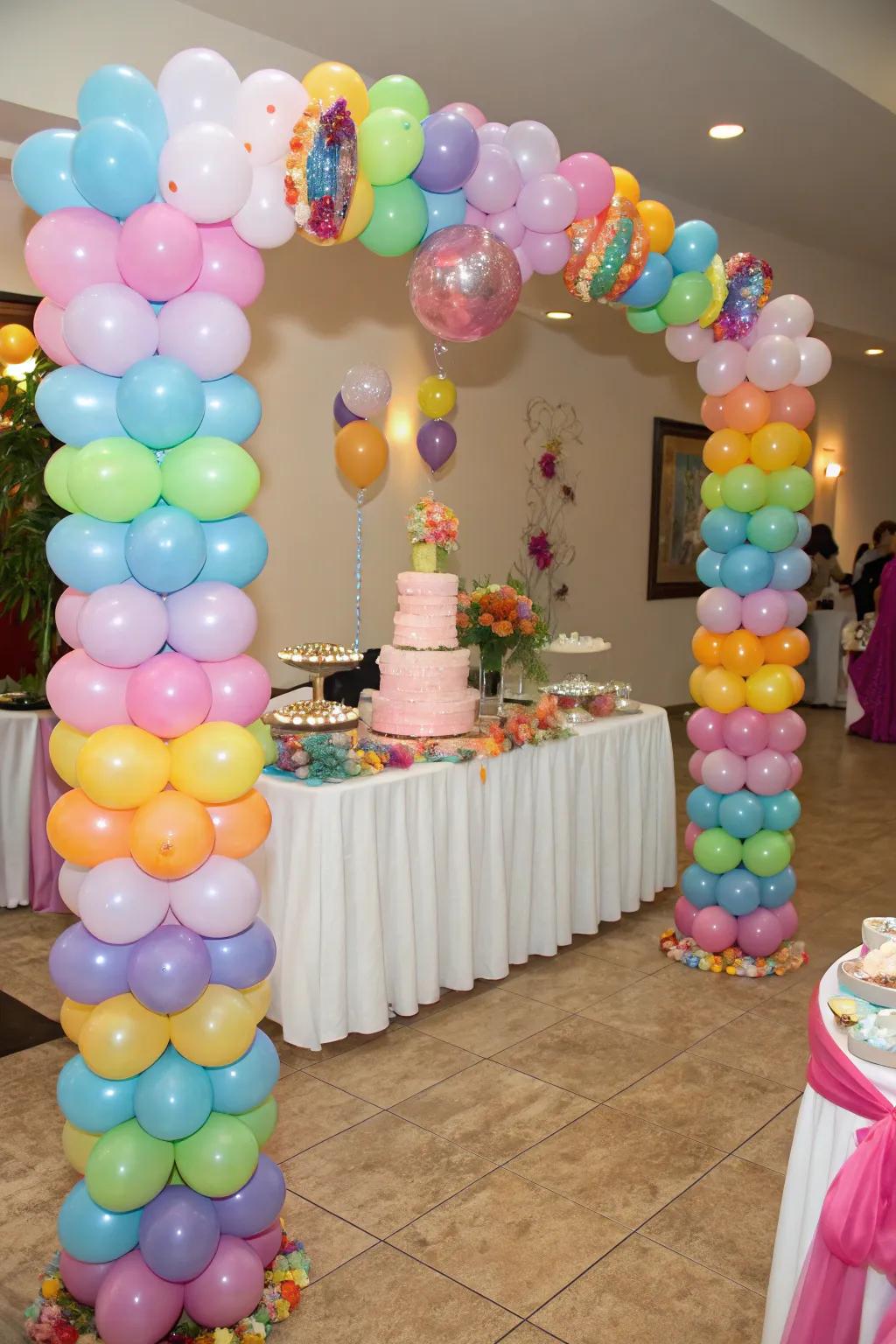 Balloon columns elegantly frame the cake table.