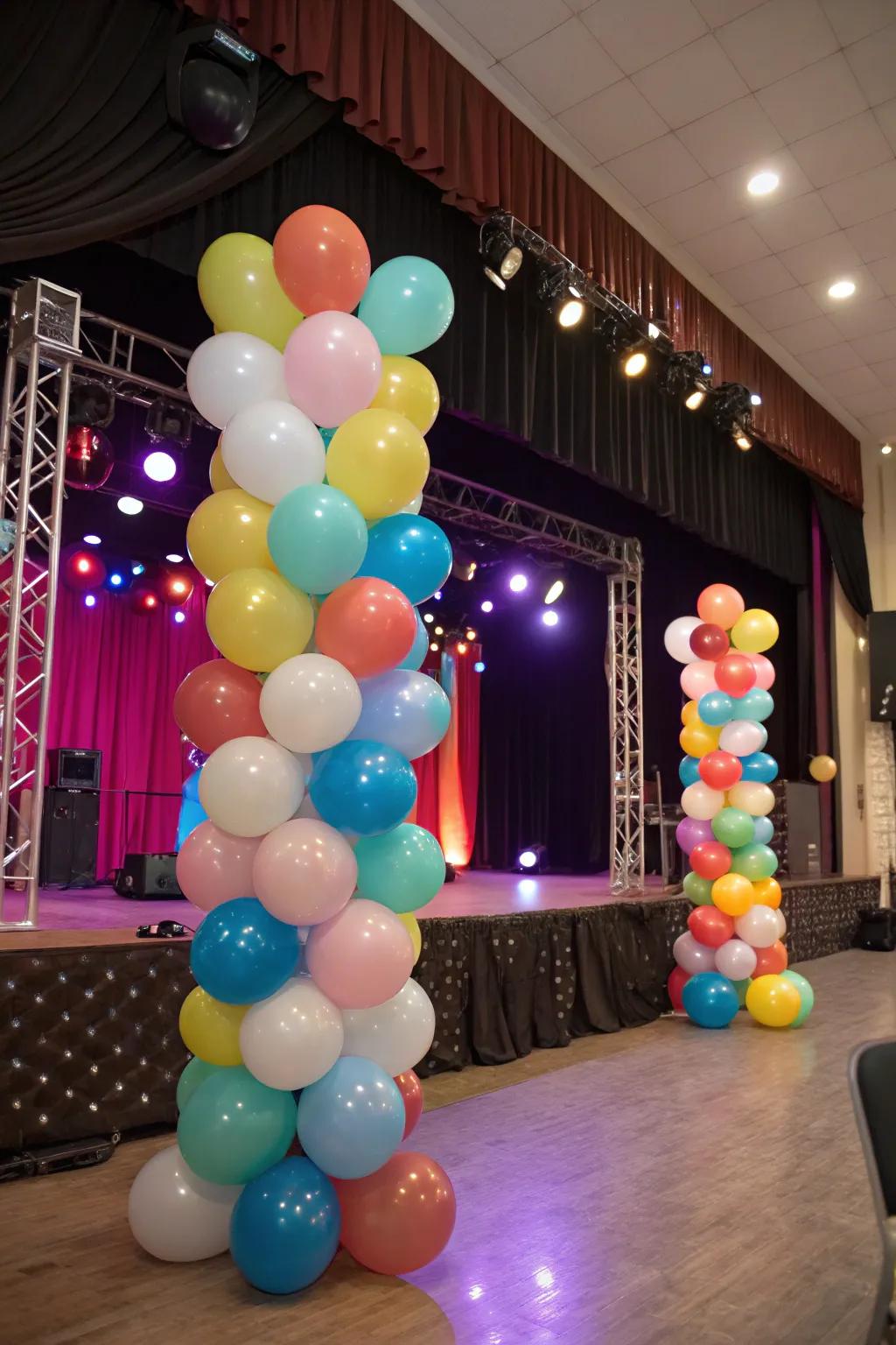 A vibrant stage arrangement showcasing balloons of assorted dimensions and hues.