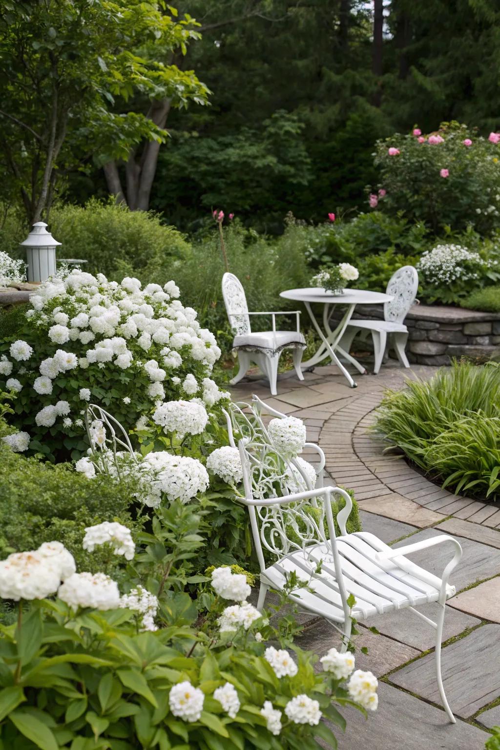 White garden furniture complements the serene aesthetic of a white garden.