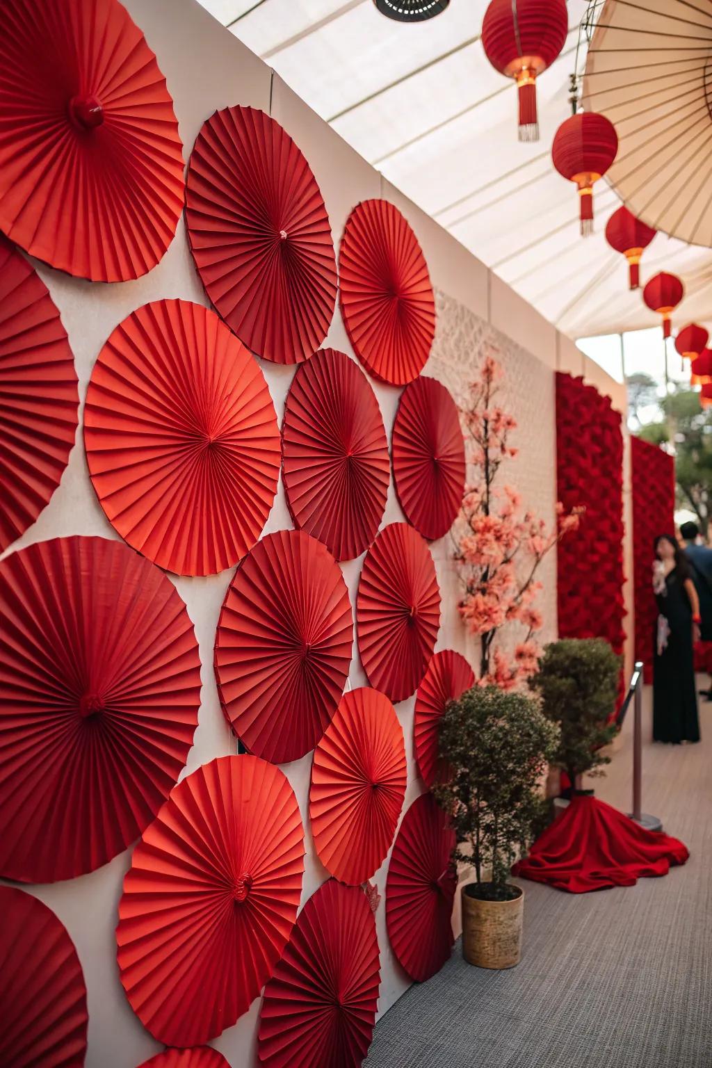 A creative red paper fan wall backdrop for memorable photos.